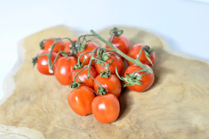 Cherry tomatoes on a wooden board